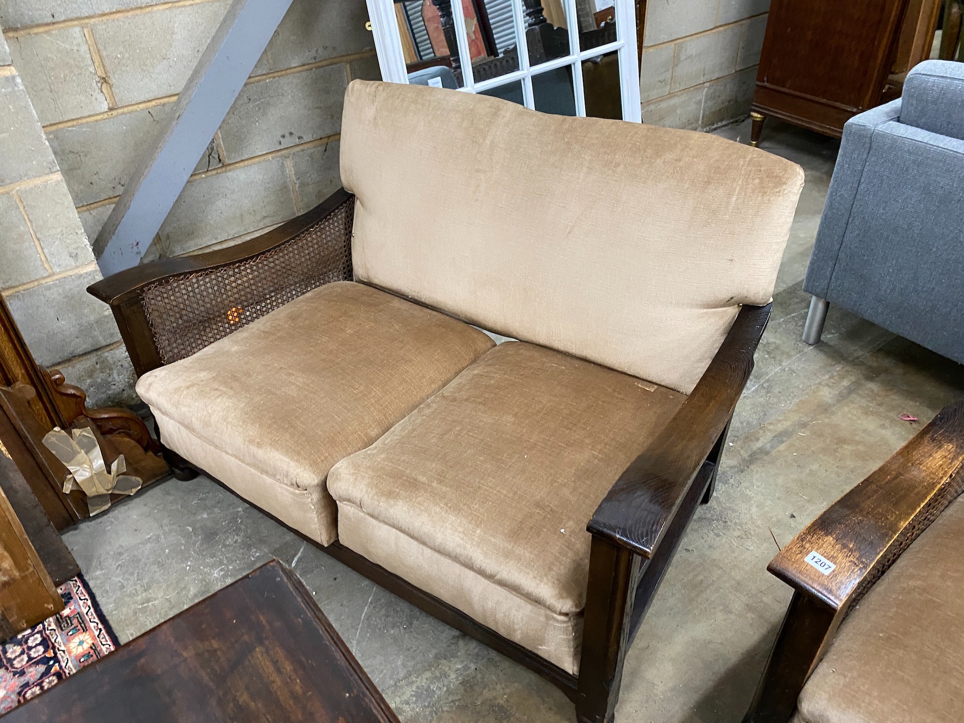 A 1930's oak and single caned three piece bergere suite *Please note the sale commences at 9am.